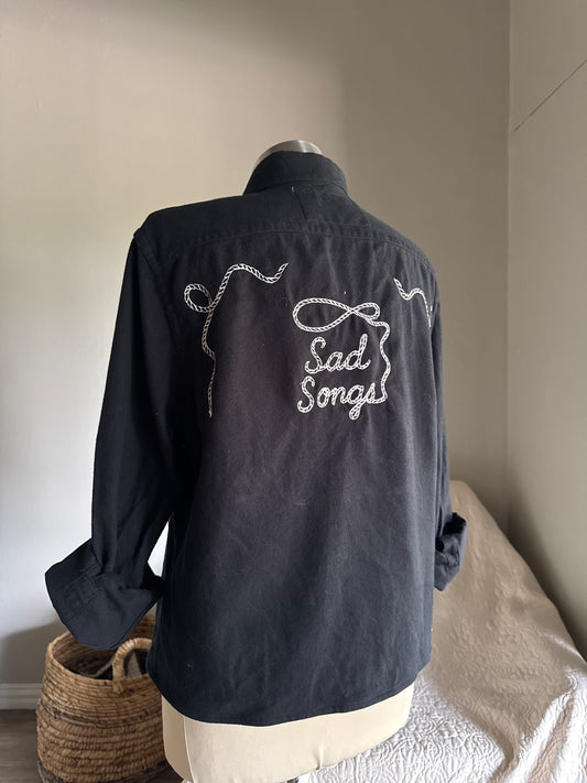 Lawrence Handcrafted Sad Songs Cropped Long Sleeve Button Down In Black