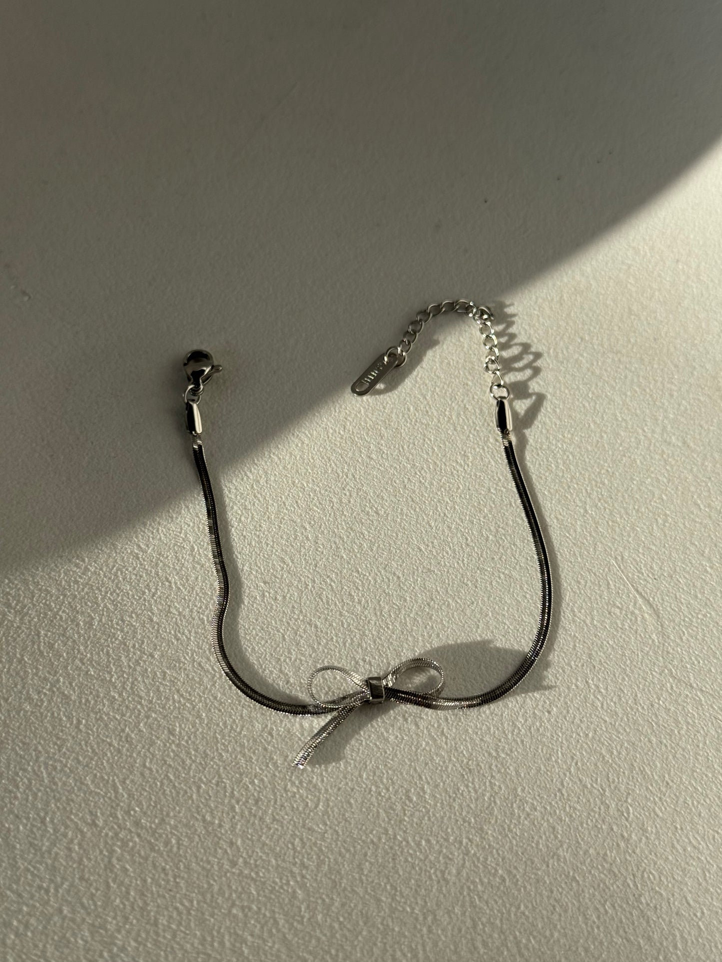 Kinsley Herringbone Chain Stainless Steel Bow Bracelet in Antique Silver