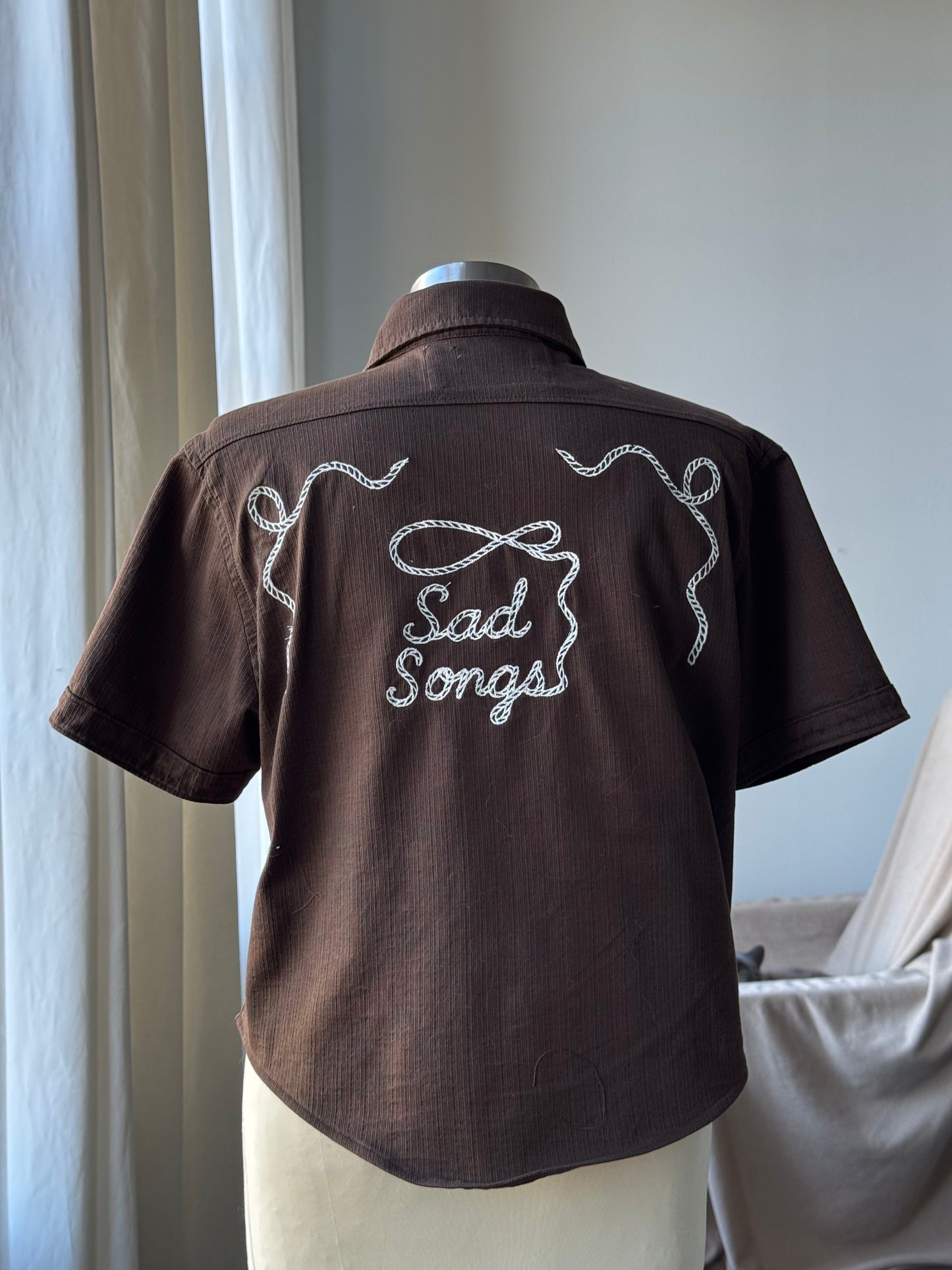 Judy Handcrafted Sad Songs Cropped Linen Button Down Short Sleeve In Brown