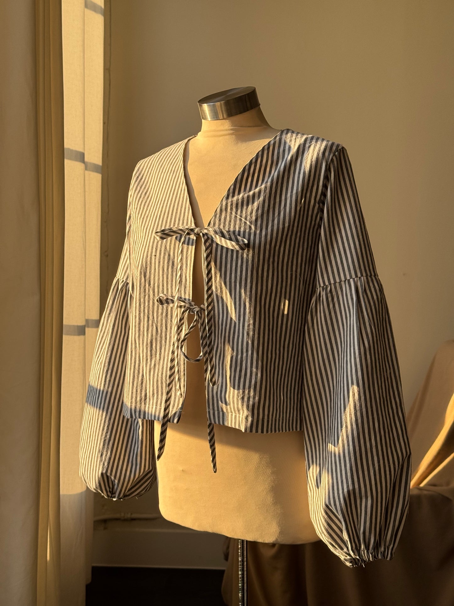 Brenda Faye Handcrafted Striped Lantern Sleeve Tie Front Top an Ash Black