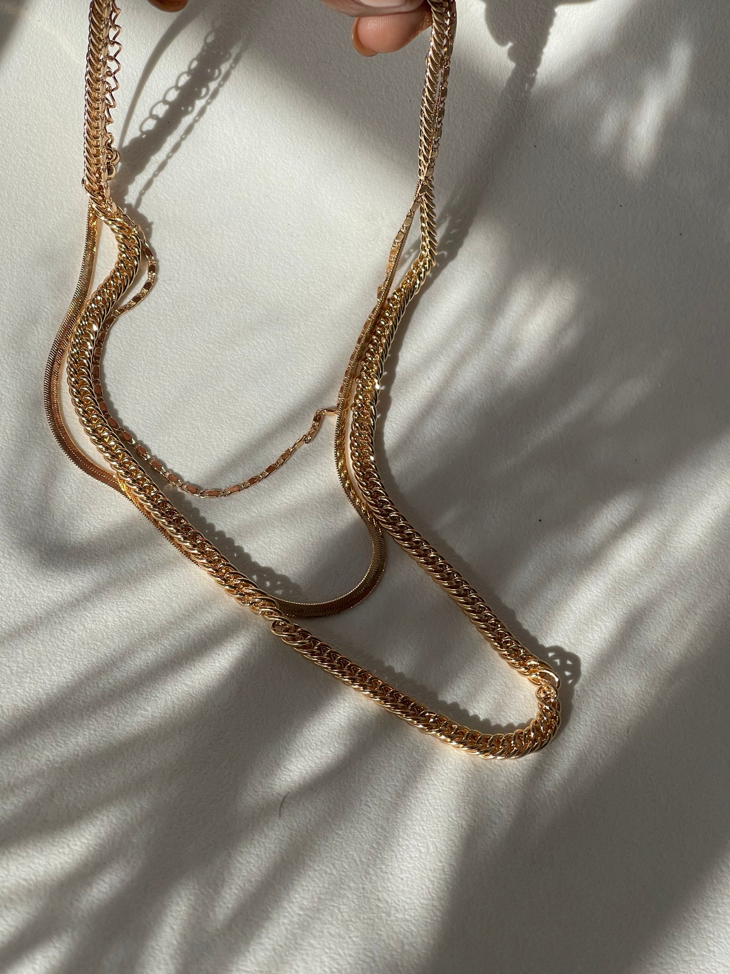 Liz Stainless Steel Tri Layered Necklace Set In Gold