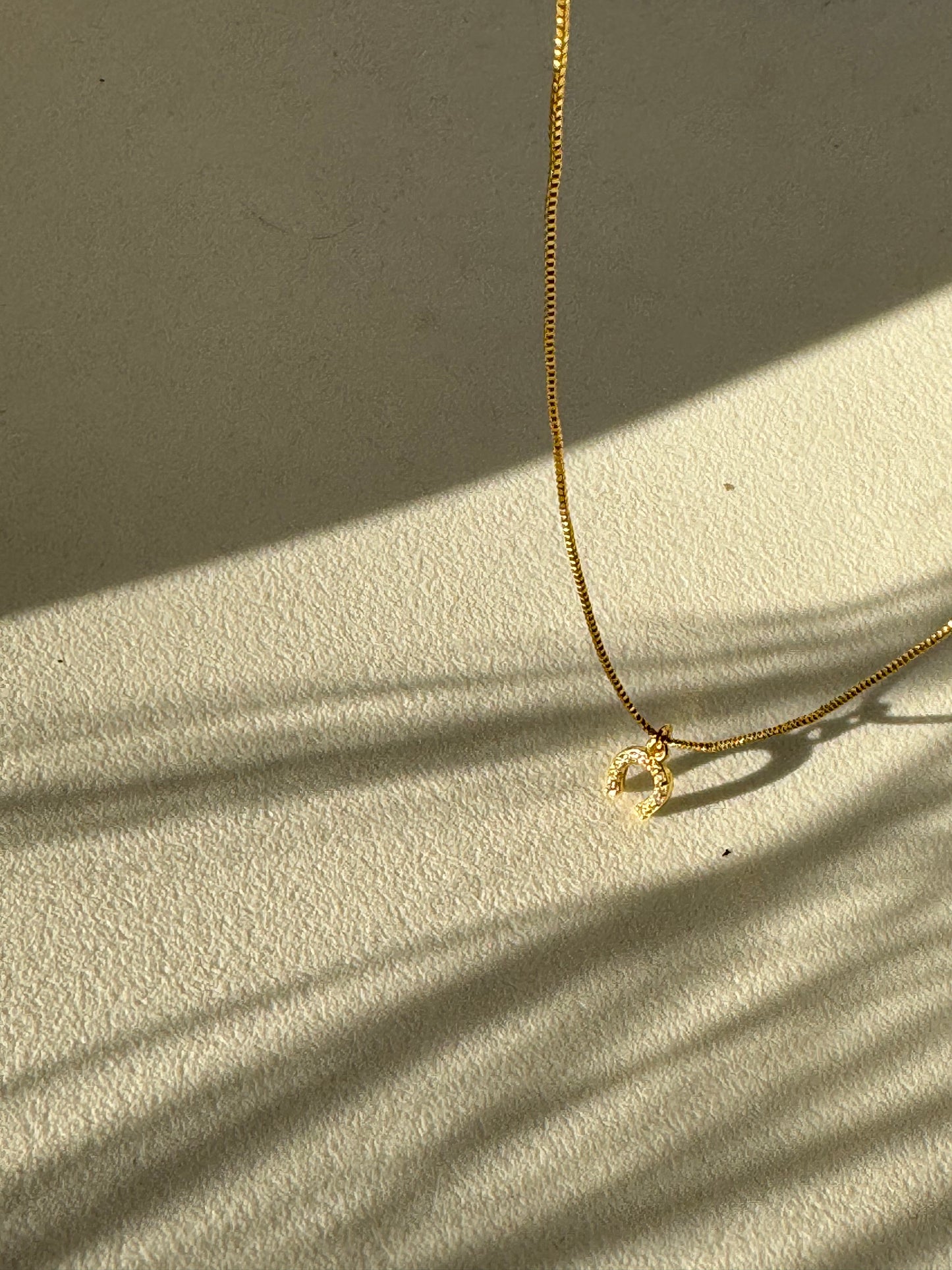 Horseshoe Mini Charm Necklace In Gold