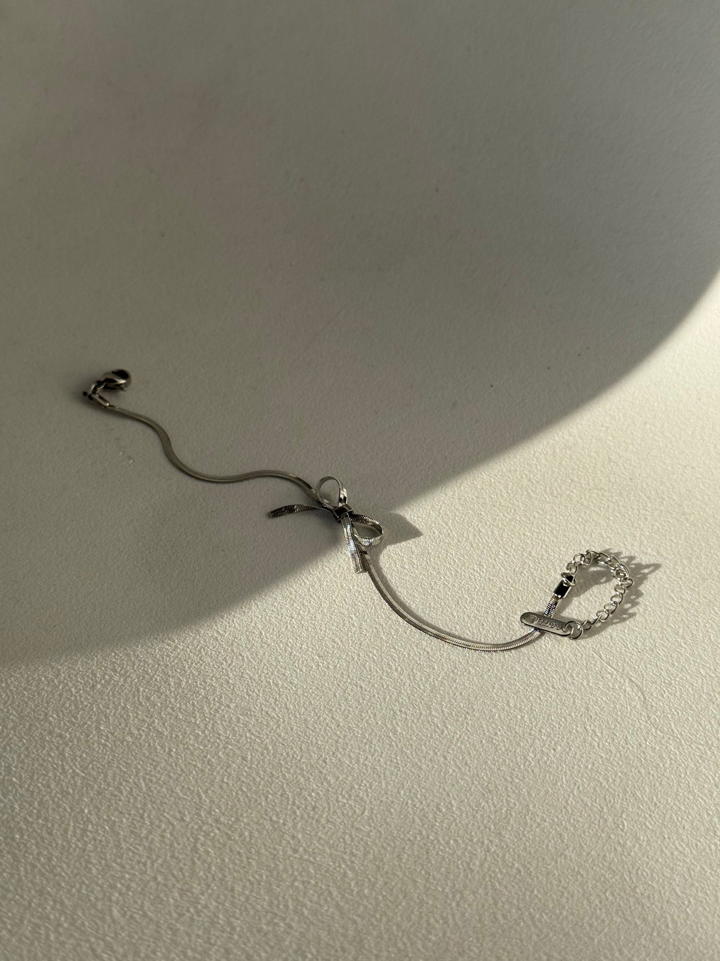 Kinsley Herringbone Chain Stainless Steel Bow Bracelet in Antique Silver