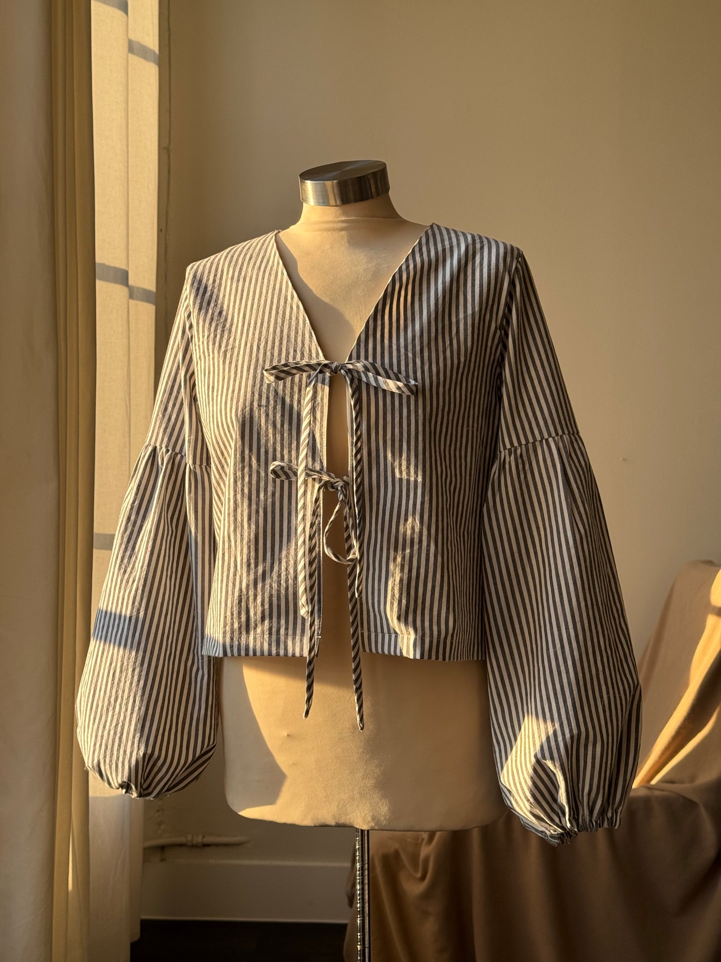 Brenda Faye Handcrafted Striped Lantern Sleeve Tie Front Top an Ash Black