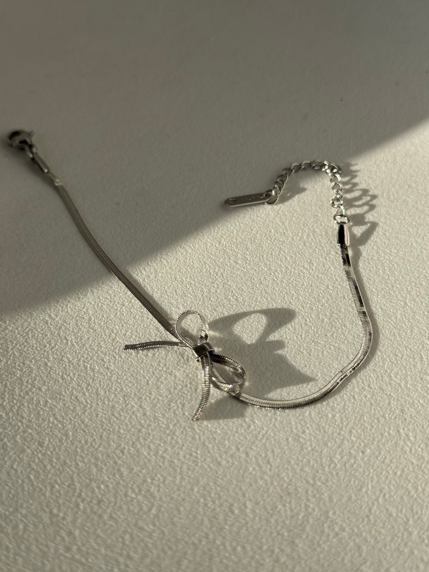 Kinsley Herringbone Chain Stainless Steel Bow Bracelet in Antique Silver