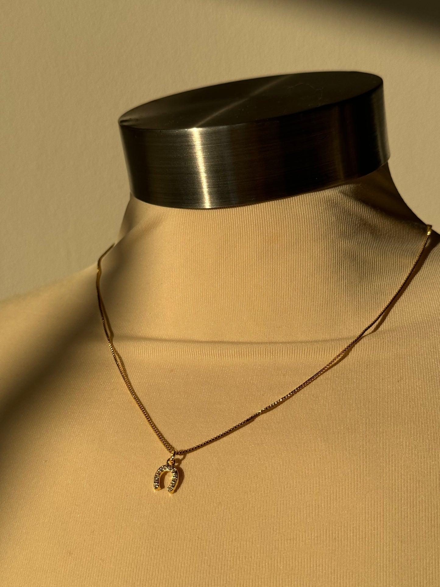 Horseshoe Mini Charm Necklace In Gold