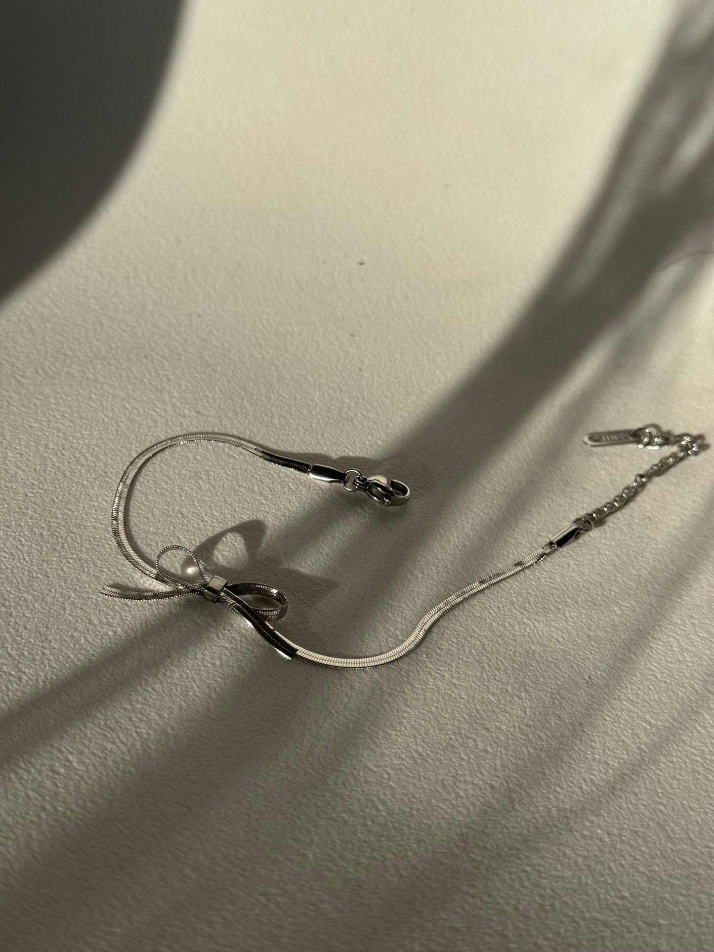 Kinsley Herringbone Chain Stainless Steel Bow Bracelet in Antique Silver