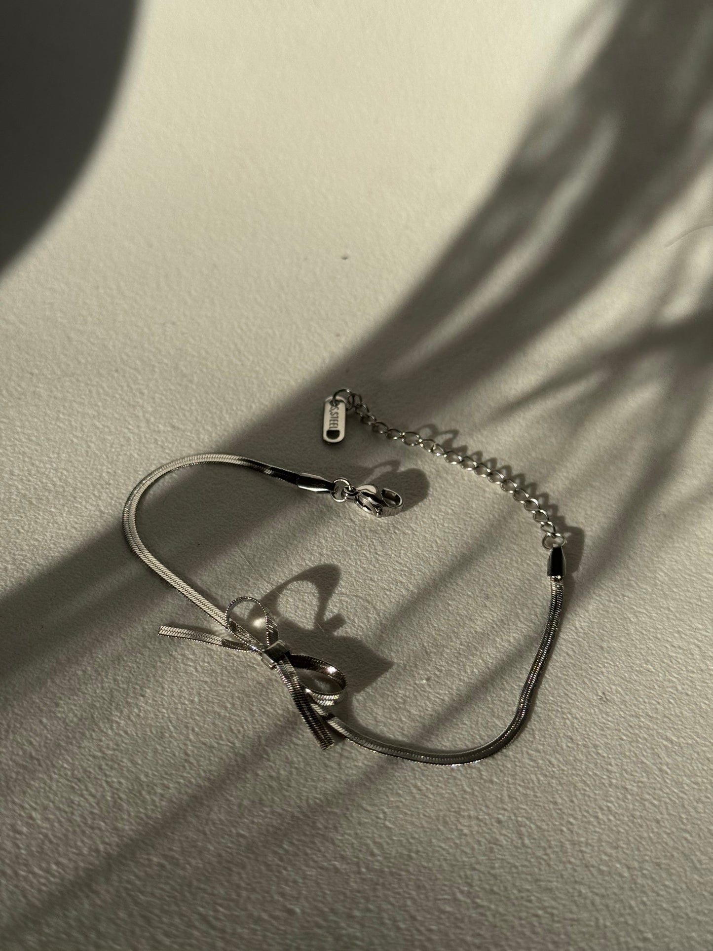 Kinsley Herringbone Chain Stainless Steel Bow Bracelet in Antique Silver