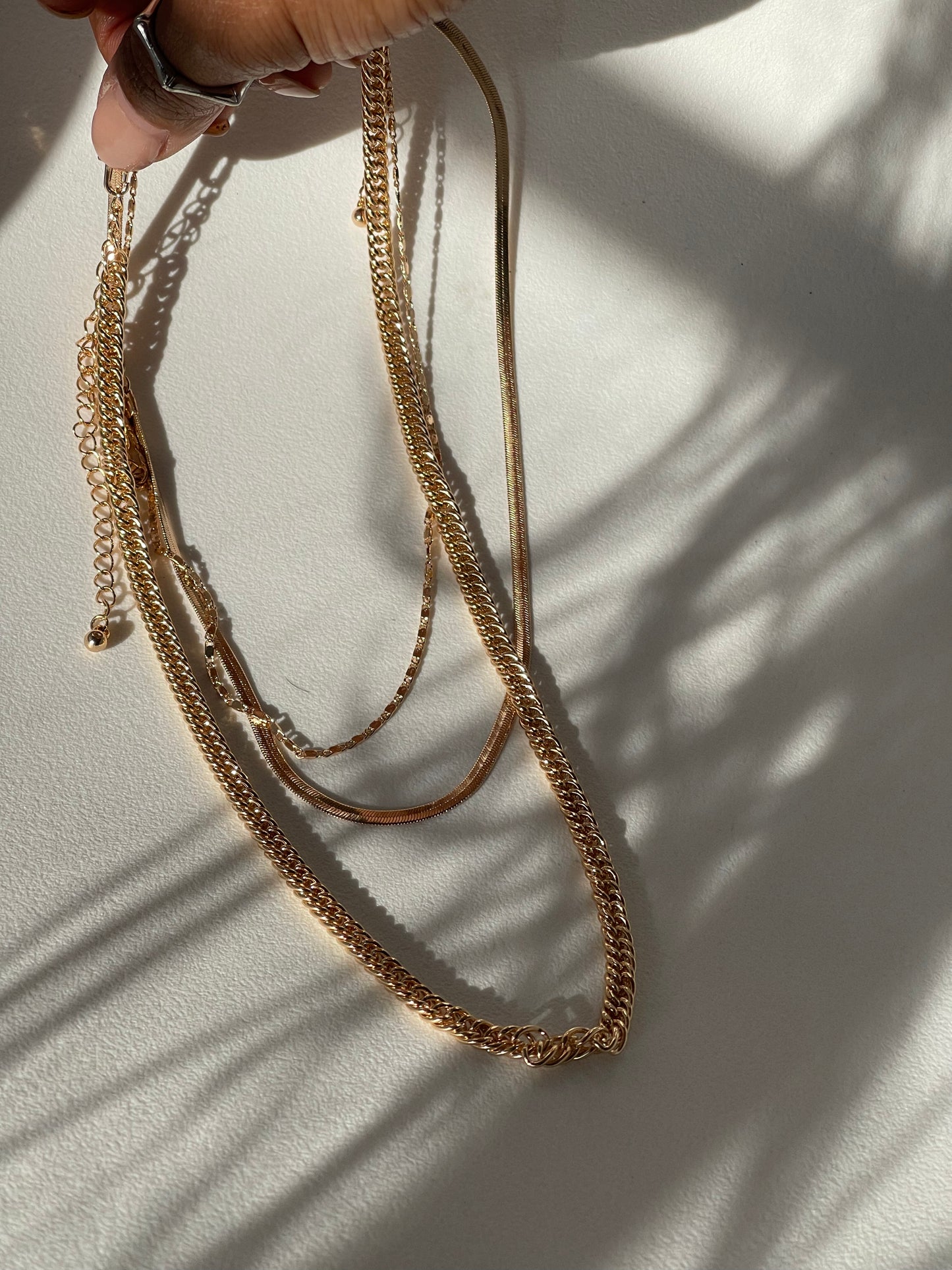 Liz Stainless Steel Tri Layered Necklace Set In Gold