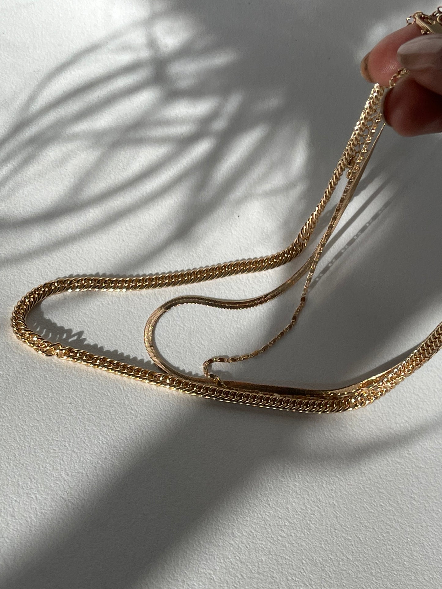 Liz Stainless Steel Tri Layered Necklace Set In Gold