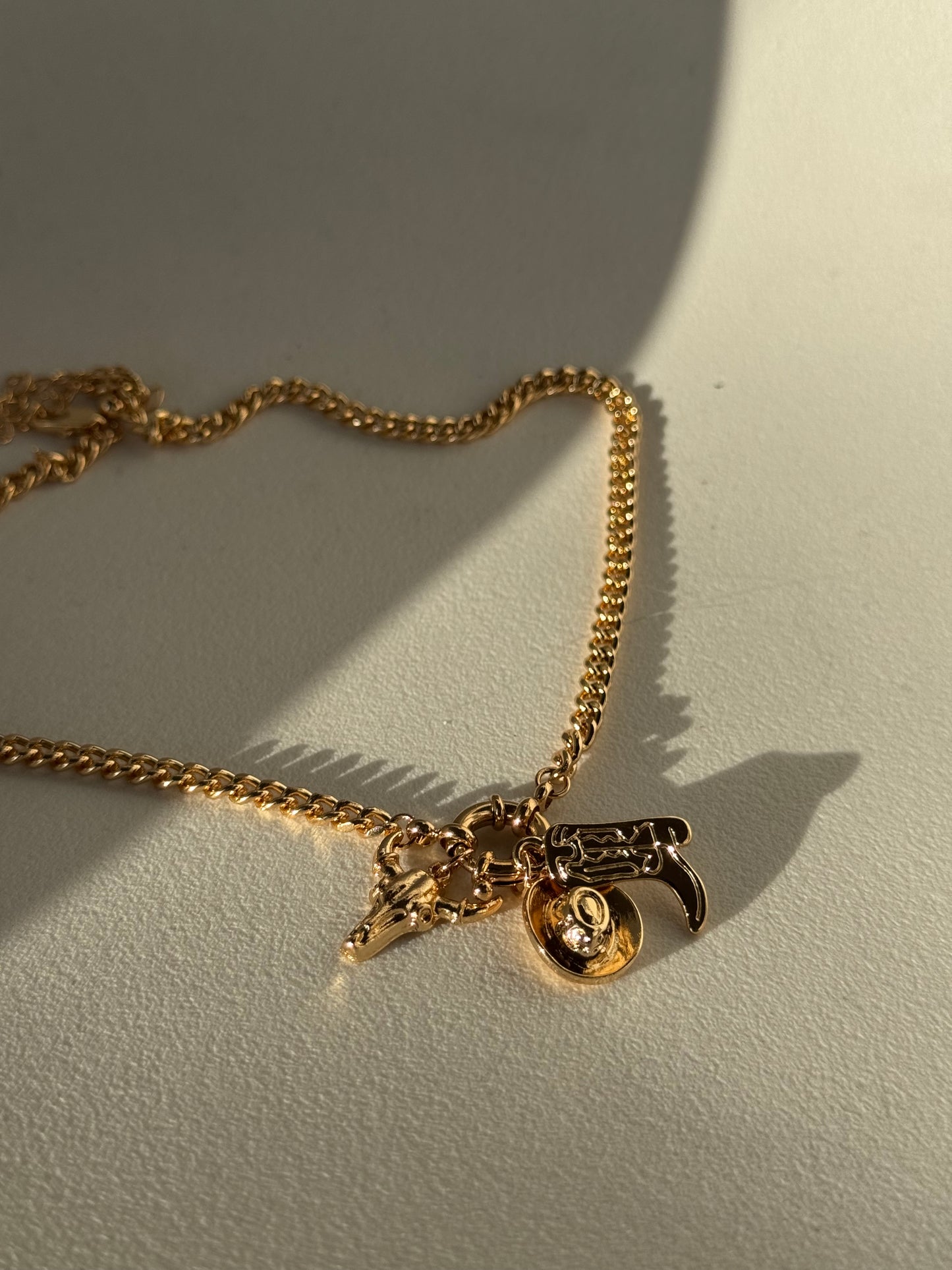 Delilah Hat Boot & Skull Charm Necklace In Gold
