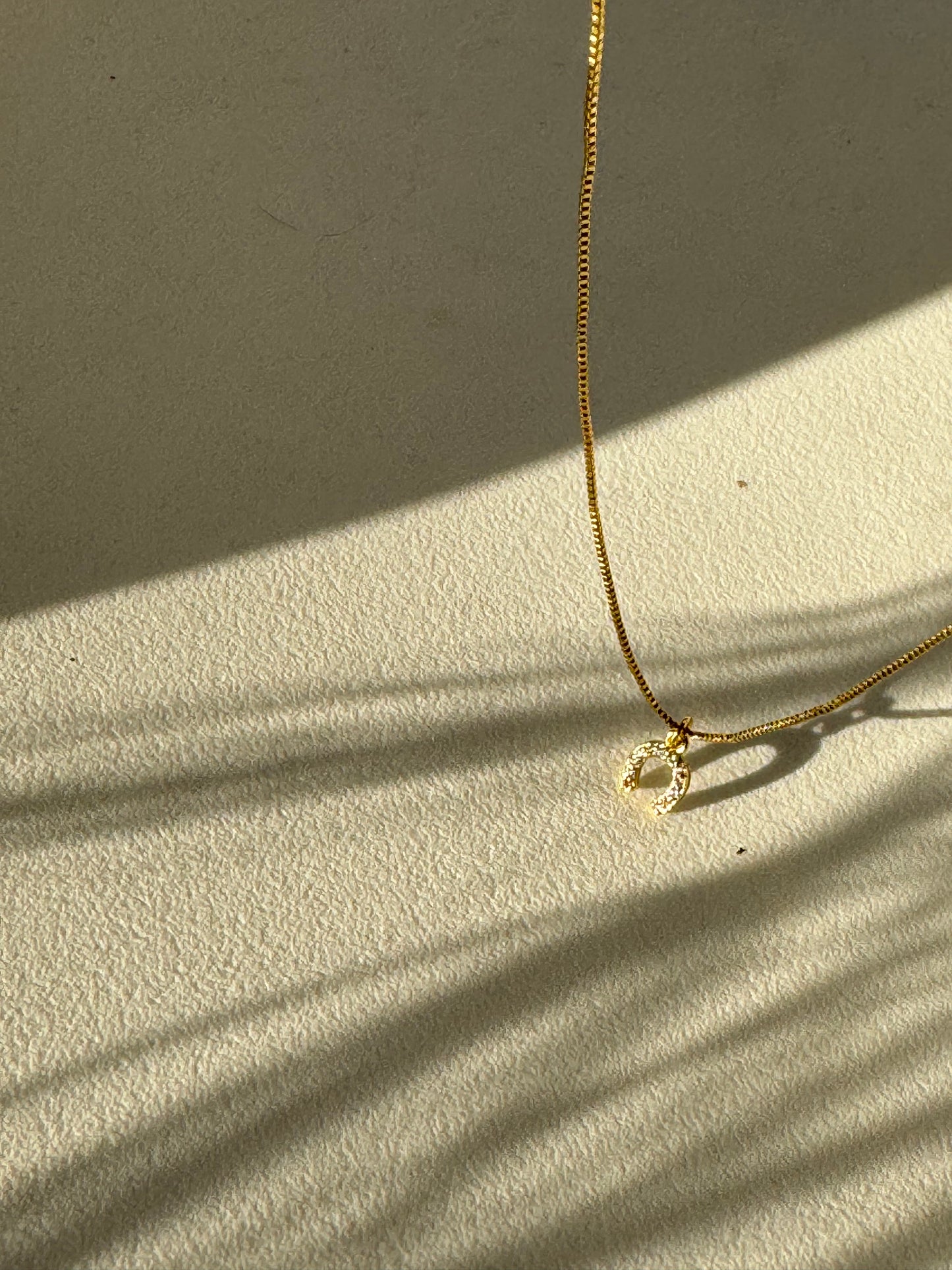 Horseshoe Mini Charm Necklace In Gold