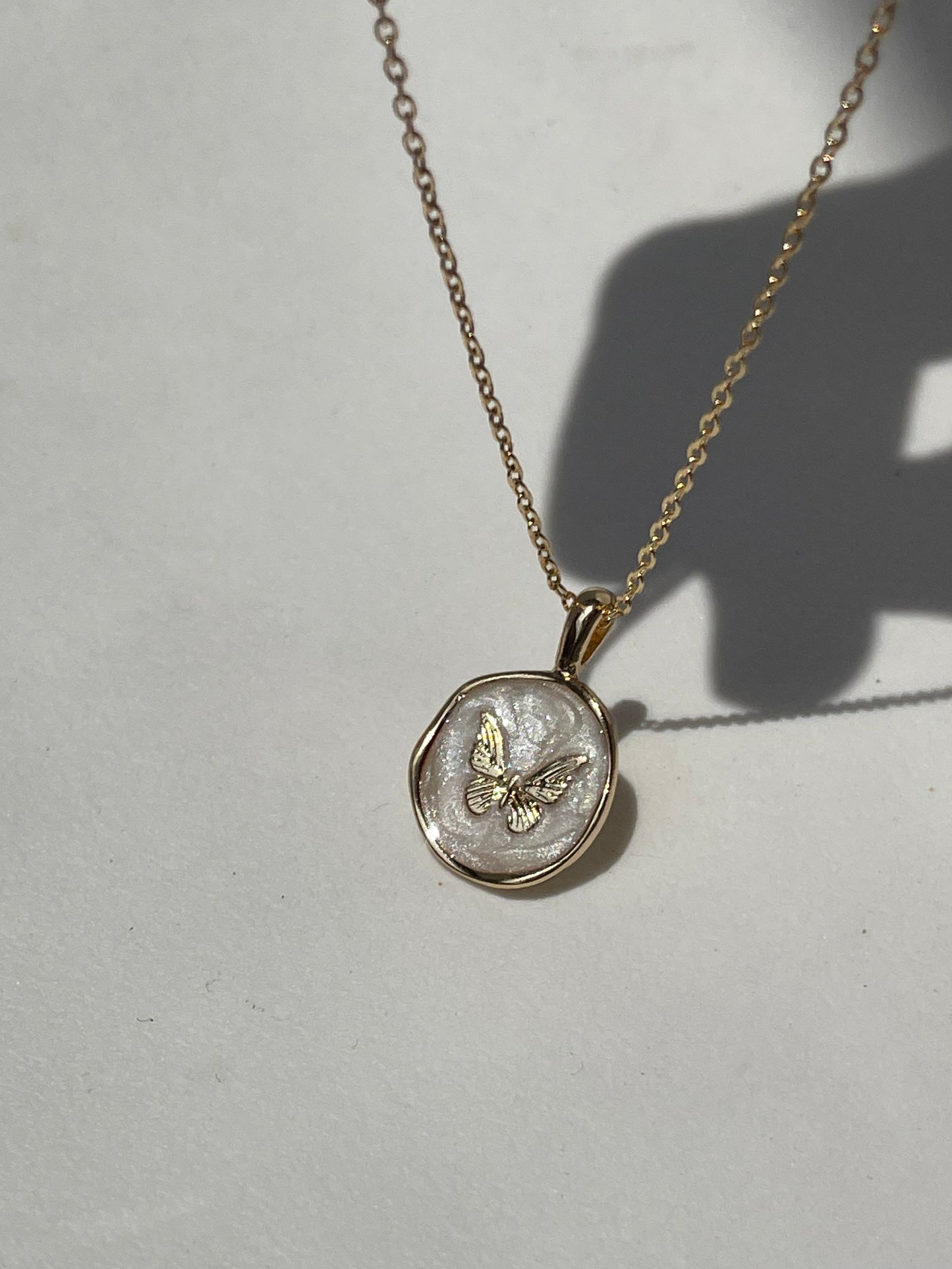 Bell Butterfly Gold Rim Disk Necklace In Ivory Gold