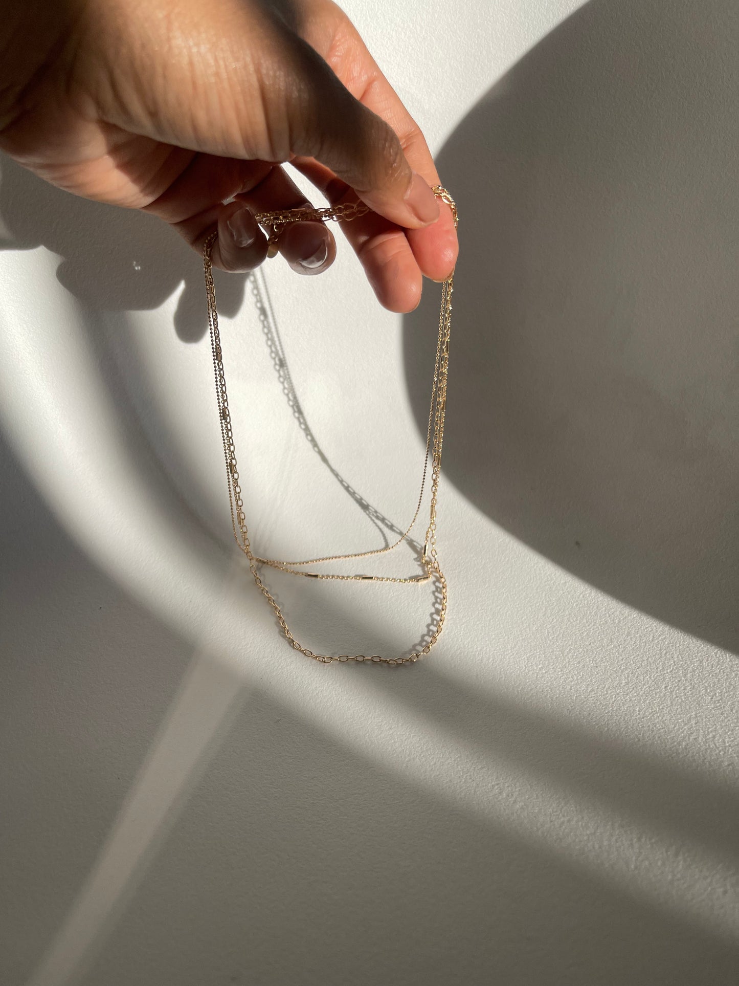 Coraline Tri Layered Assorted Necklace In Gold