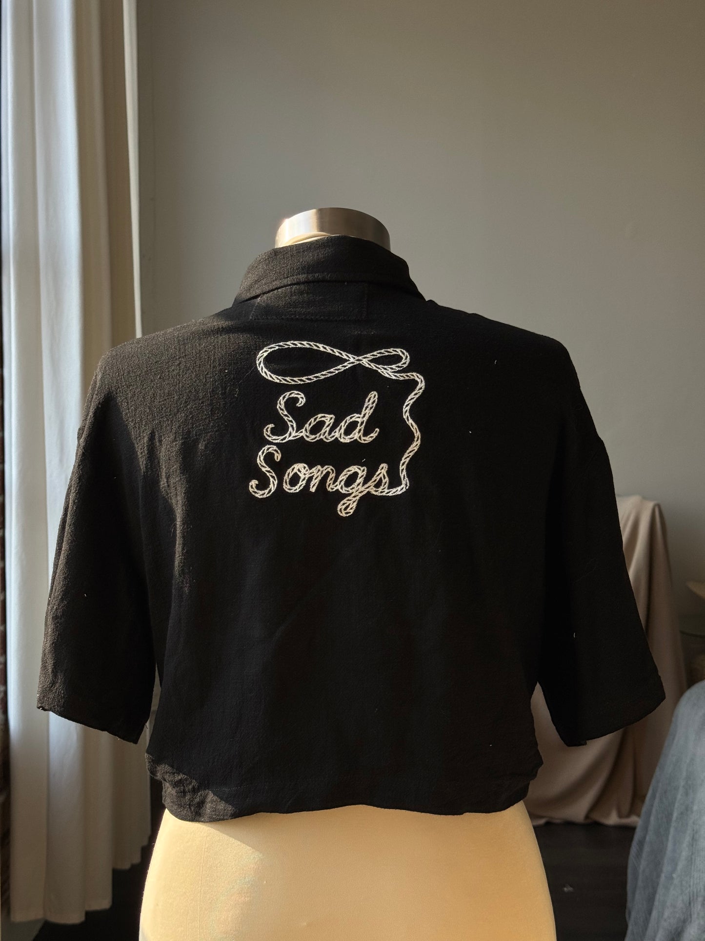 Judy Handcrafted Embroidered Sad Songs Cropped Button Down In Black