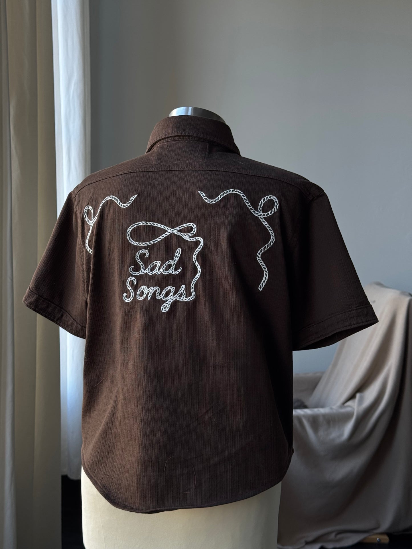 Judy Handcrafted Sad Songs Cropped Linen Button Down Short Sleeve In Brown