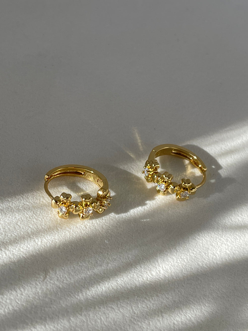 Rebecca Stainless Steel Tri Floral Charm Hug Hoop Earring In Yellow Gold