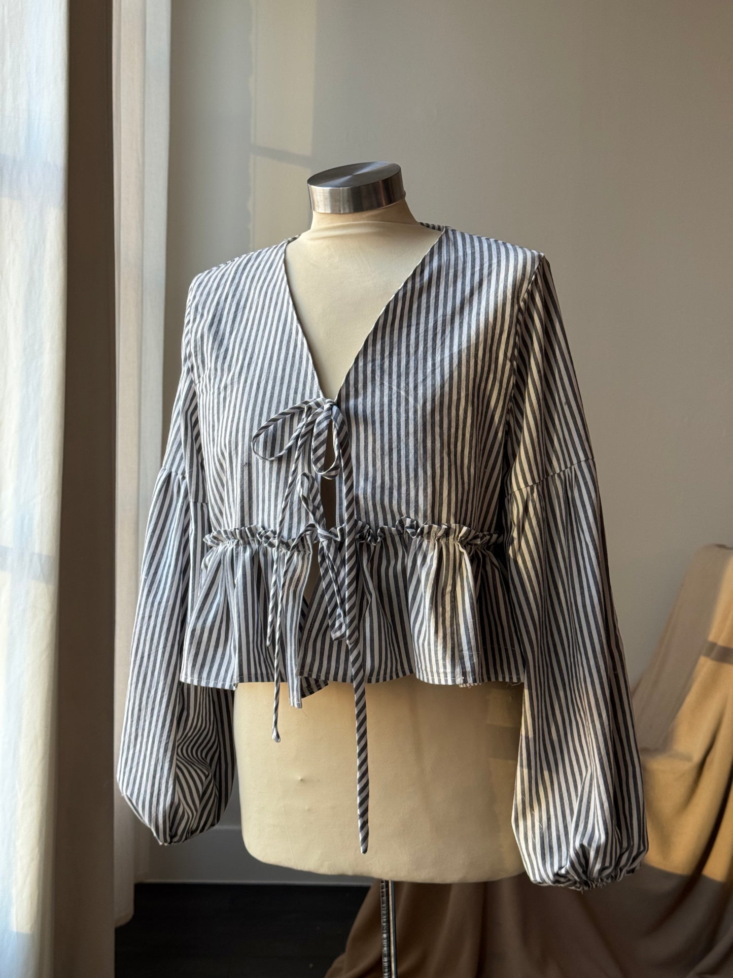 Florene Vintage Lantern Sleeve Ruffle Tie Front Top