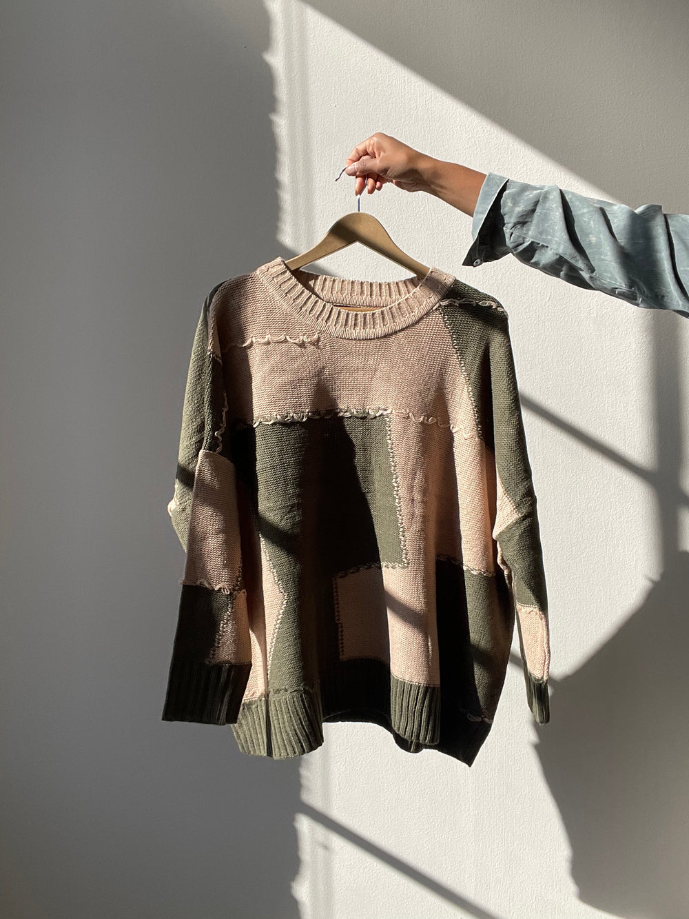 Nico Distressed Color Block Sweater In Taupe Olive