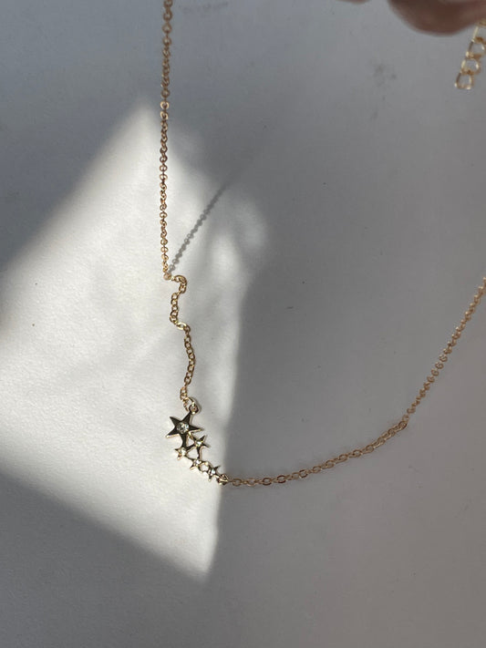 Galaxy Star Dust Charm Necklace In Gold