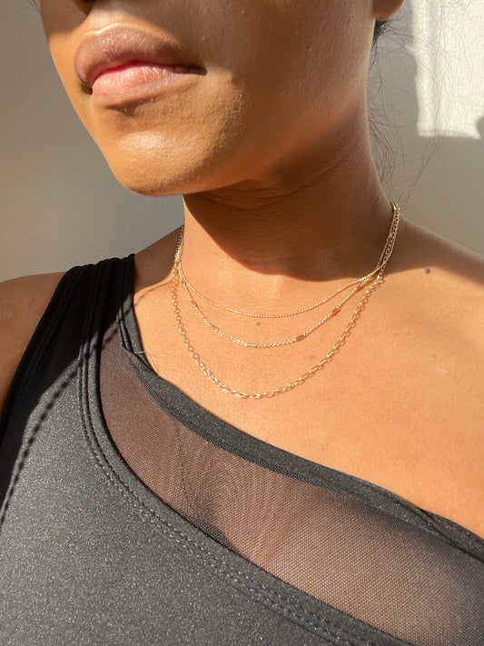 Coraline Tri Layered Assorted Necklace In Gold