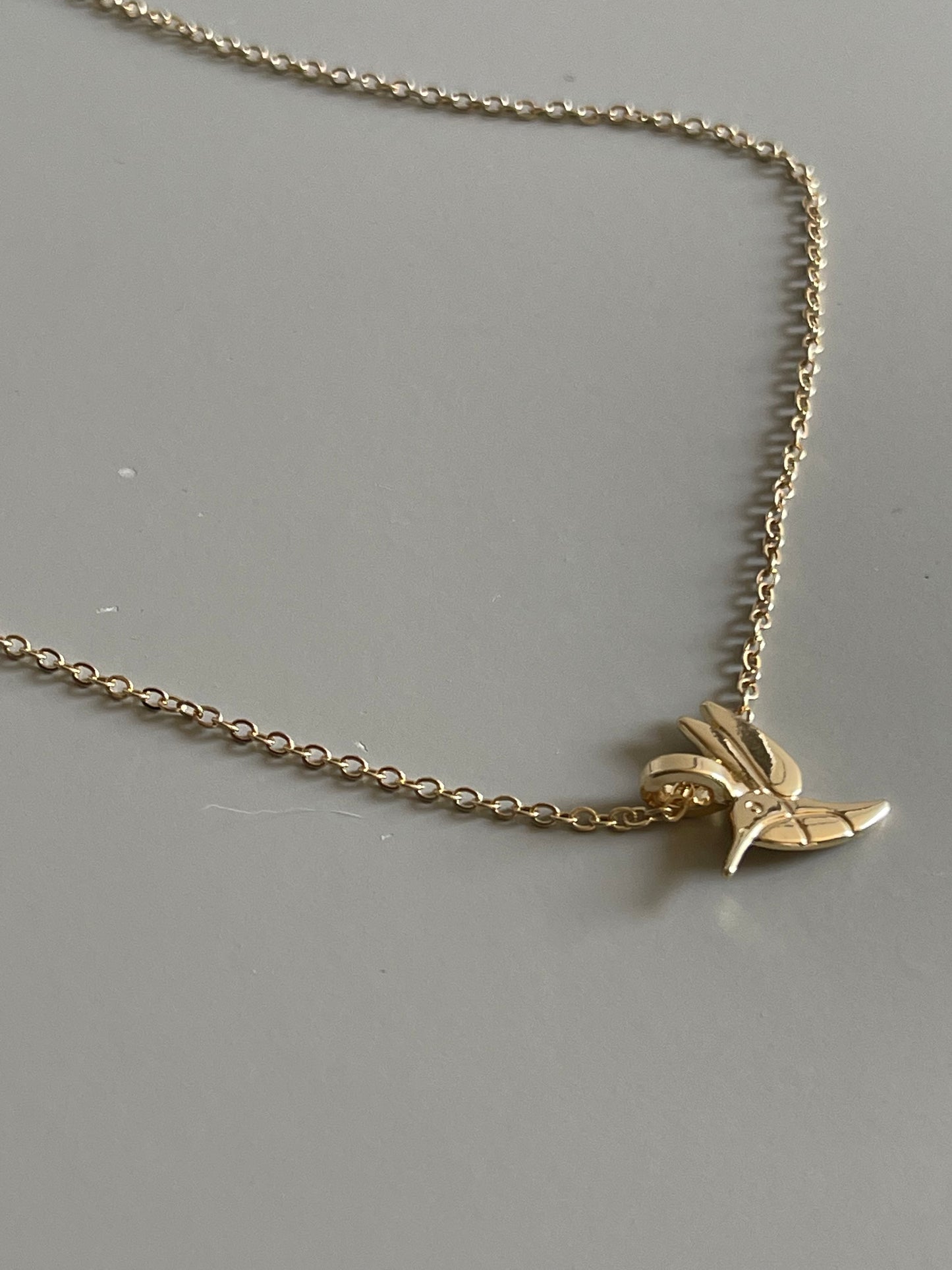 Hummingbird Charm Necklace In Gold