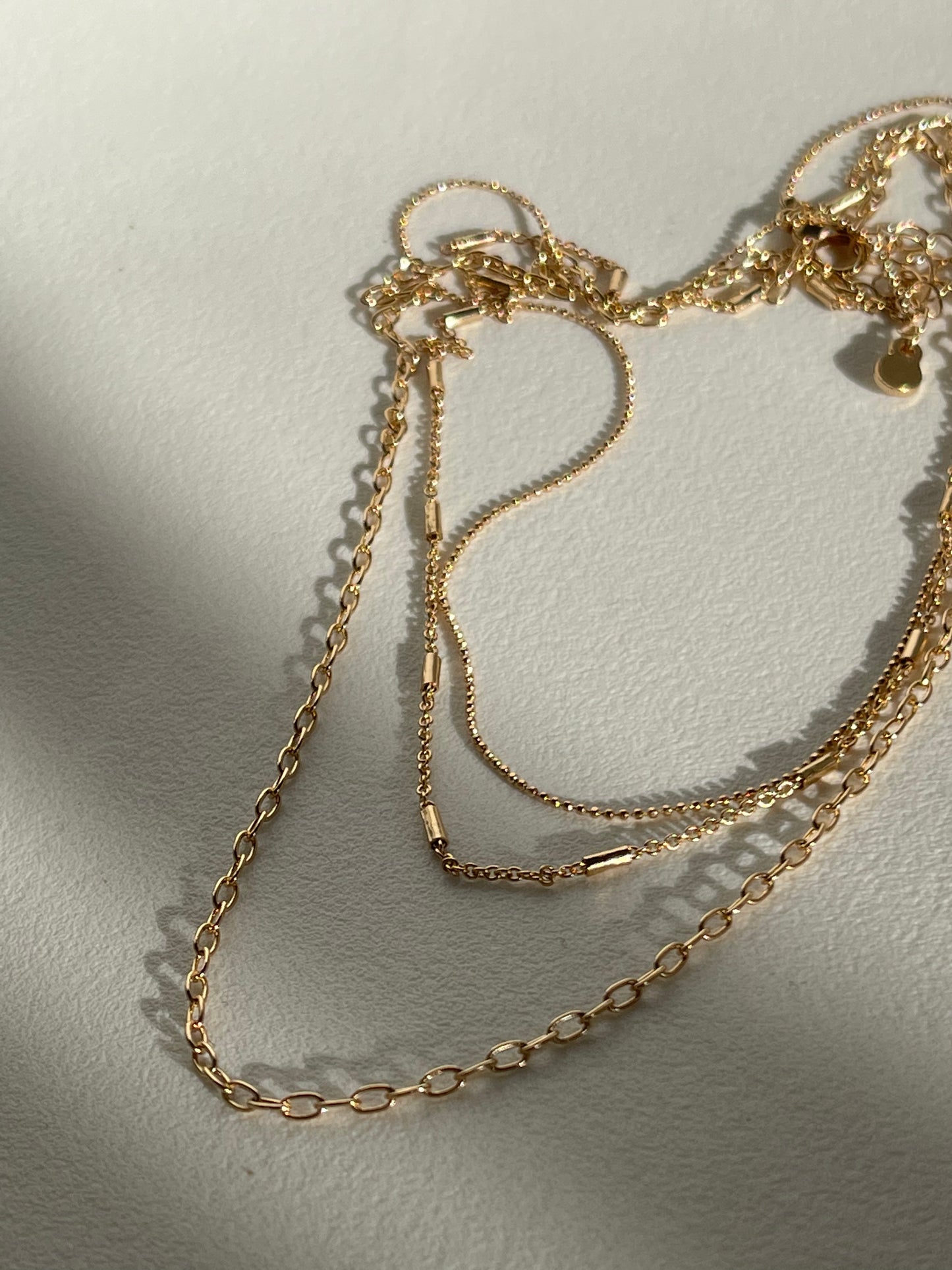 Coraline Tri Layered Assorted Necklace In Gold
